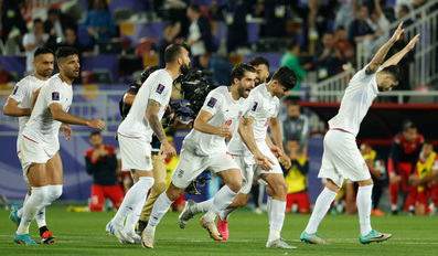 Iran's players celebrate their win